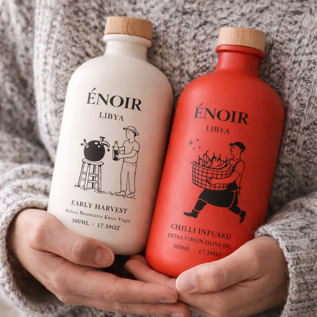 Holding ÉNOIR bottles
